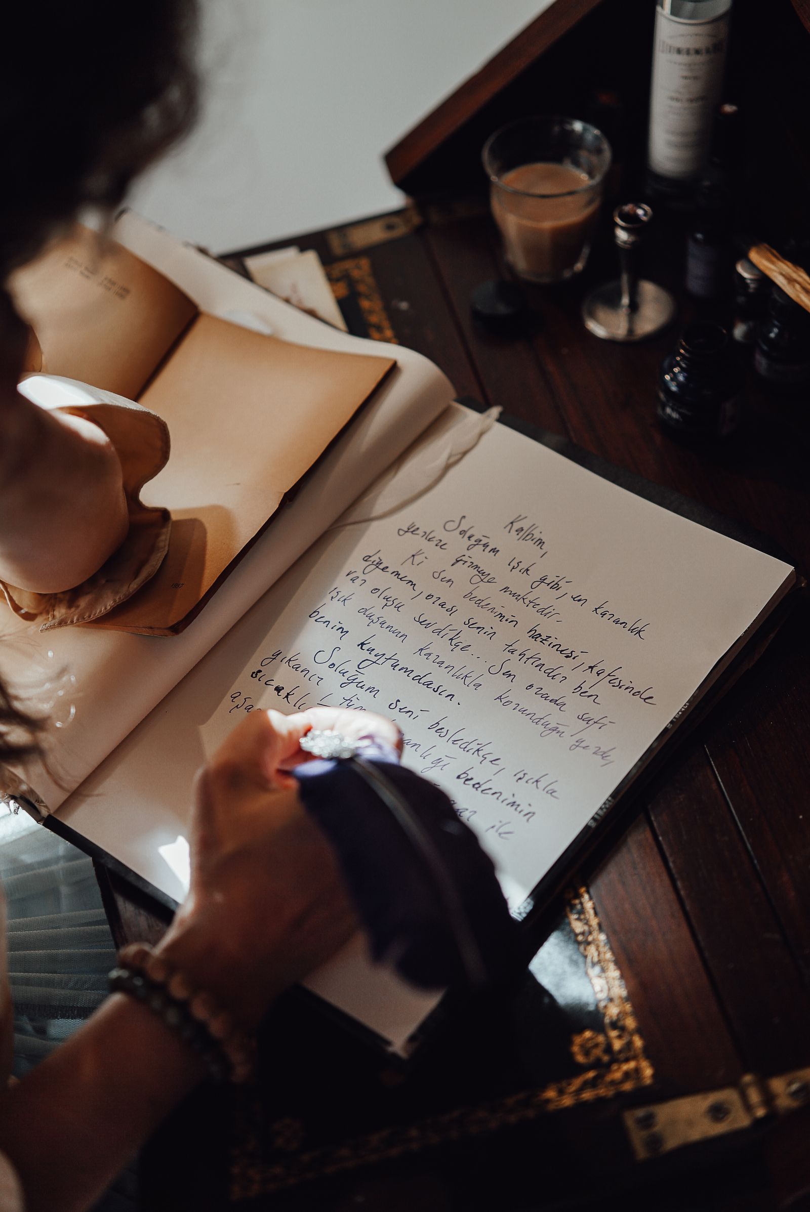 Handwritten crèche notebooks and registers open on a desk