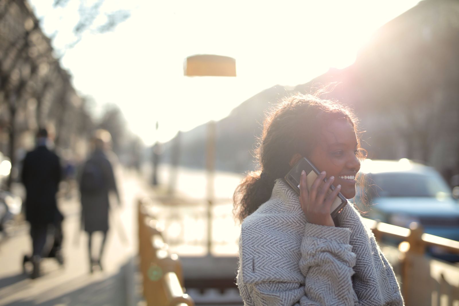 A crèche principal on the phone, smiling