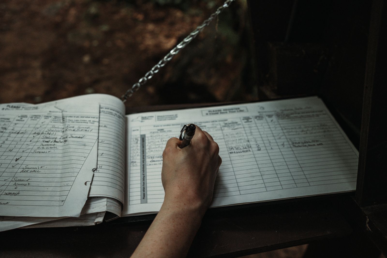 A handwritten paper attendance register in morning light
